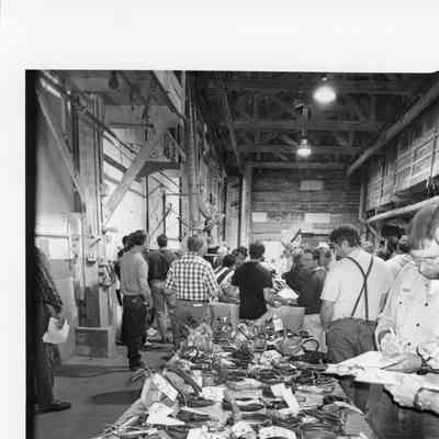 Table with hoses attached to a device during auction 1996