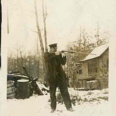 Man aiming firearm