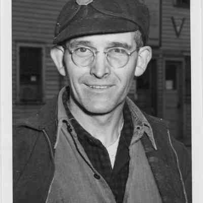 Man in stormy Kromer hat with LD Smith ID badge attached to hat