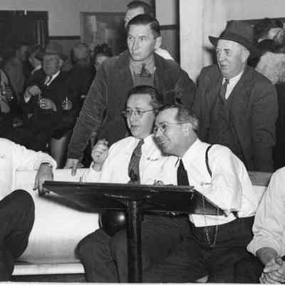 Leathem D. Smith and employees at bowling alley