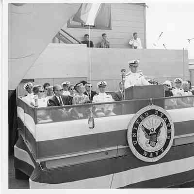 Man at podium during christening ceremony of PG 93 Welch