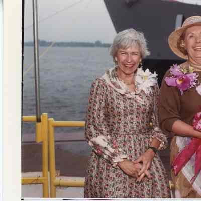 Two women with flowers at MCM-1 USS Avenger launch