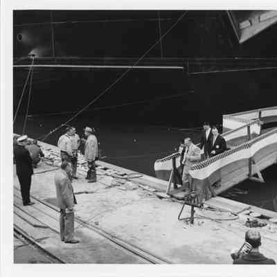 C. Ray Christianson and wife leaving sponsor box at Spartan christening September 6, 1952