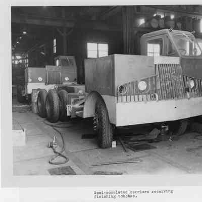 Semi-completed carriers receiving finishing touches at Christy Corp