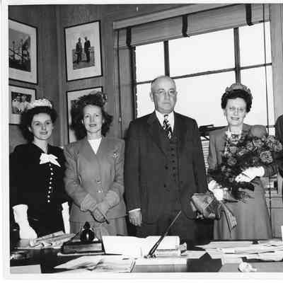 Mrs. Robert Rote, Jr. Alva Smith, and Leathem D. Smith in office at christening of AK-205 USS Poinsett
