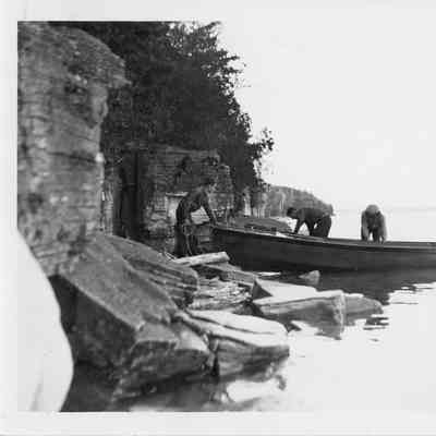 motor boat pulled up to rocky shore at Patowatomie State Park