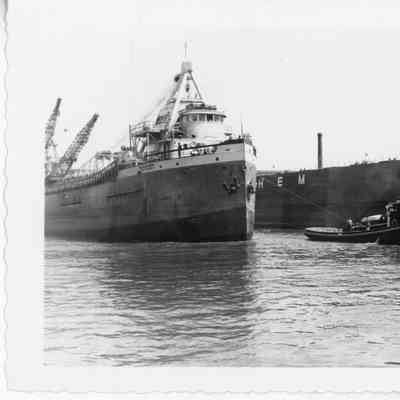 Tugboat Wyoming towing self-unloading freighter