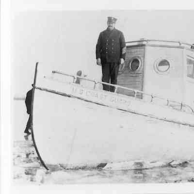 Plum Island Coast Guard boat with three men on board