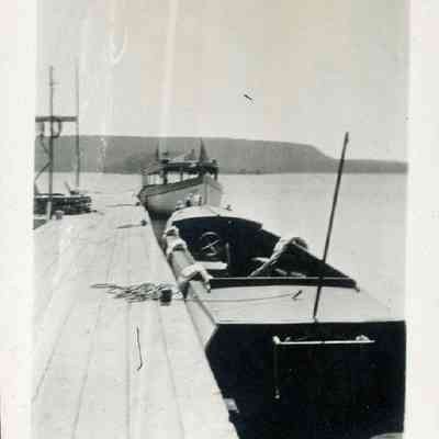launch and powerboat docked at Cabot's Lodge 1916