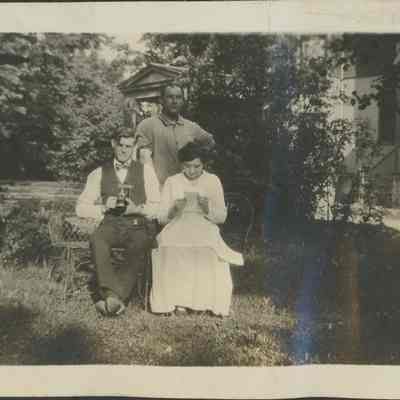 three people pose for photograph