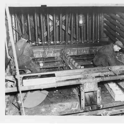 Two men working on Norway interior