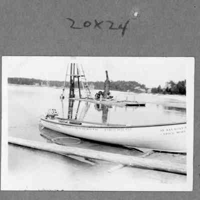 Sturgeon bay Boat Works stock model with ELTO motor attached on beach
