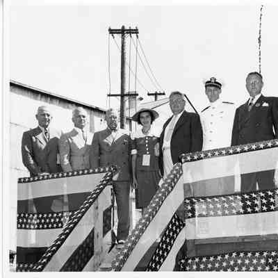 C. Ray Christianson and sponsoring party in sponsor box at Leathem D. Smith Shipbuilding Co.