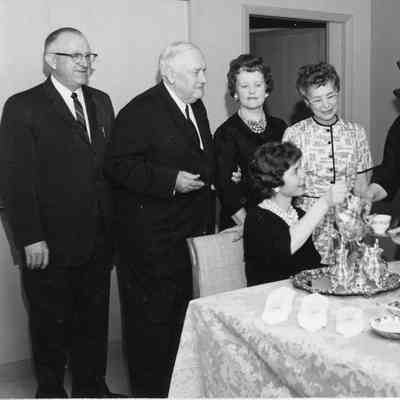 C. Ray Christianson and man along with four women having lunch