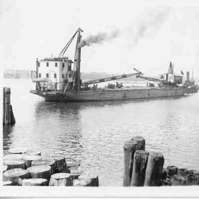 Barge Transport being towed by tugboat