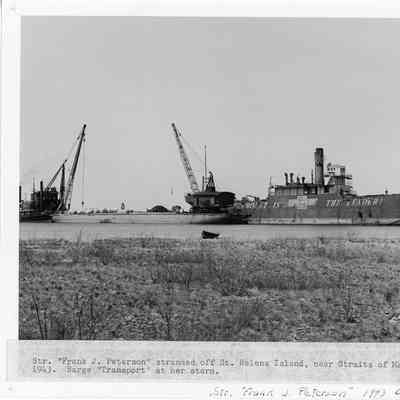 Steamer Frank J. Peteson stranded with barge Transport 1943