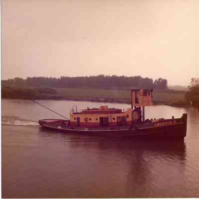 Tug Adrienne B towing freighter