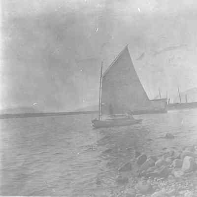 Man in boat in water near shore