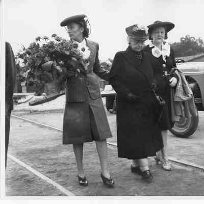 Mrs. Sydney T. Smith holding roses