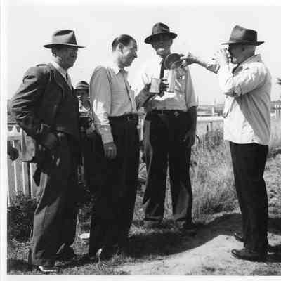 Men drinking at SBSB&DD Co. 1st annual picnic August 22, 1943