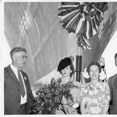Thomas M. Woodward and three others in front of PF-64 USS Knoxville