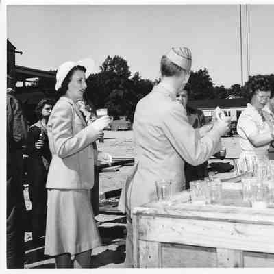 Group drinking at christening of P-571 at Peterson Boat Works July 15, 1944