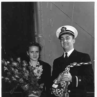 Marilyn Hughes and sailor at christening of AK-209 Schyler