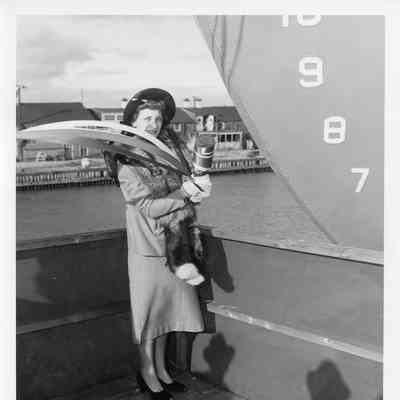 Woman about to christen vessel at Christy Corp