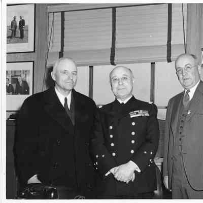 Geo L. Gilkey, L.D. Smith and Admiral Raymond Fenard
