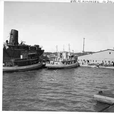 Tugs docked next to the George M. Humphrey at Sturgeon Bay Shipbuilding and Drydock Company