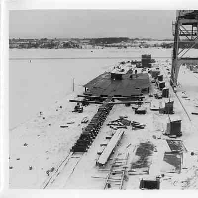 Hull of Spartan under construction in snow January 9, 1951