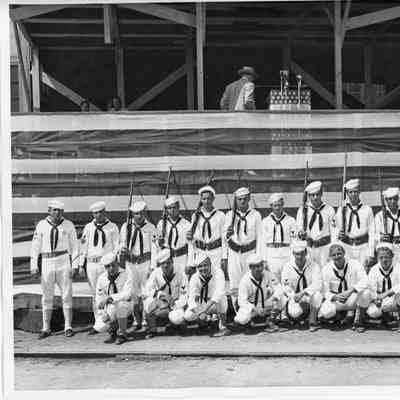 US Coast Guard color guard standing in front of speaker box