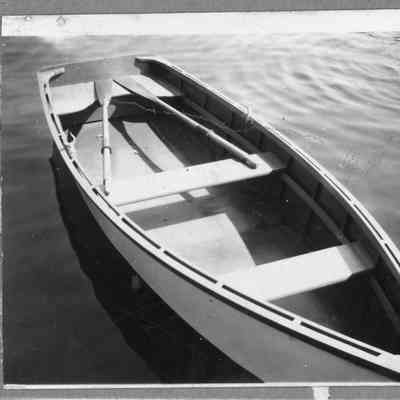 Rowboat with paddles in water