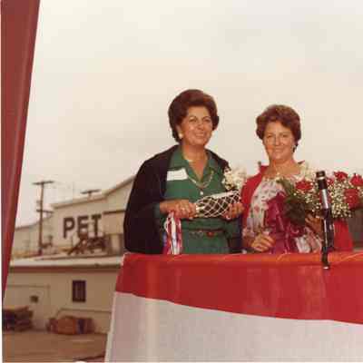 two women with flowers at christening of Napolean