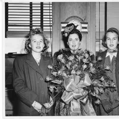 Patsy Smith and Suzanne Smith with sponsor holding roses