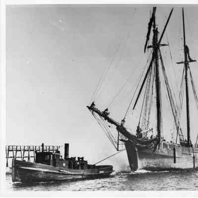 Nellie Redington being towed by tugboat