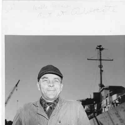 Walter Sell posing in front of ship