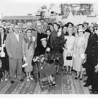 Group of people on deck at launching of LST-1170, May 22, 1954