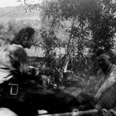 Man and Woman Sitting Outside