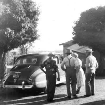 People Next to Car