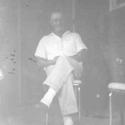 Butcher Sitting on Porch