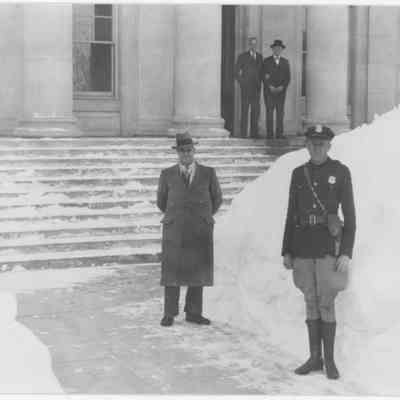 Four Men Standing Outside in Snow