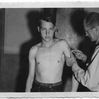 CCC Camp Doctor Gives Inoculations