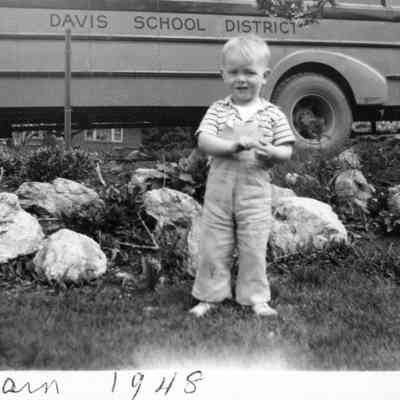 Boy by School Bus