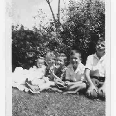 Kids Sitting on Grass