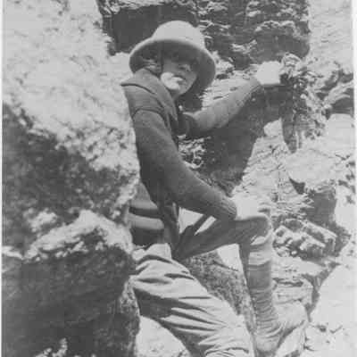 Woman Climbing Rocky Mountain