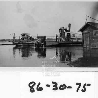 Wanista Ferry (possibly steam) running between Pasco and Kennewick. c. Spring 1921. Columbia river is at Spring crest). One model T still on ferry.