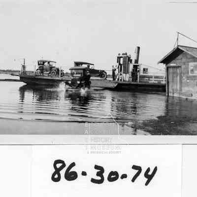 Wanista Ferry with Model T disembarking. 2 other autos still on ferry boat.