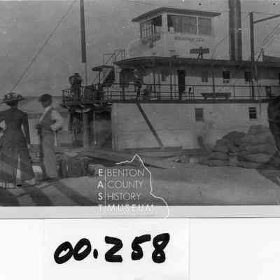 Mountain Gem at a landing. Also show are Captain Bailey and 3 passengers, No ID's (2 women, 1 man)