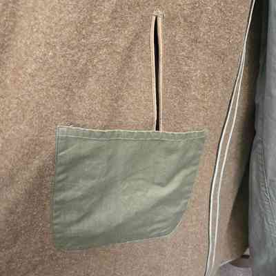 Wool lining has a pocket and slit for pants pocket access.